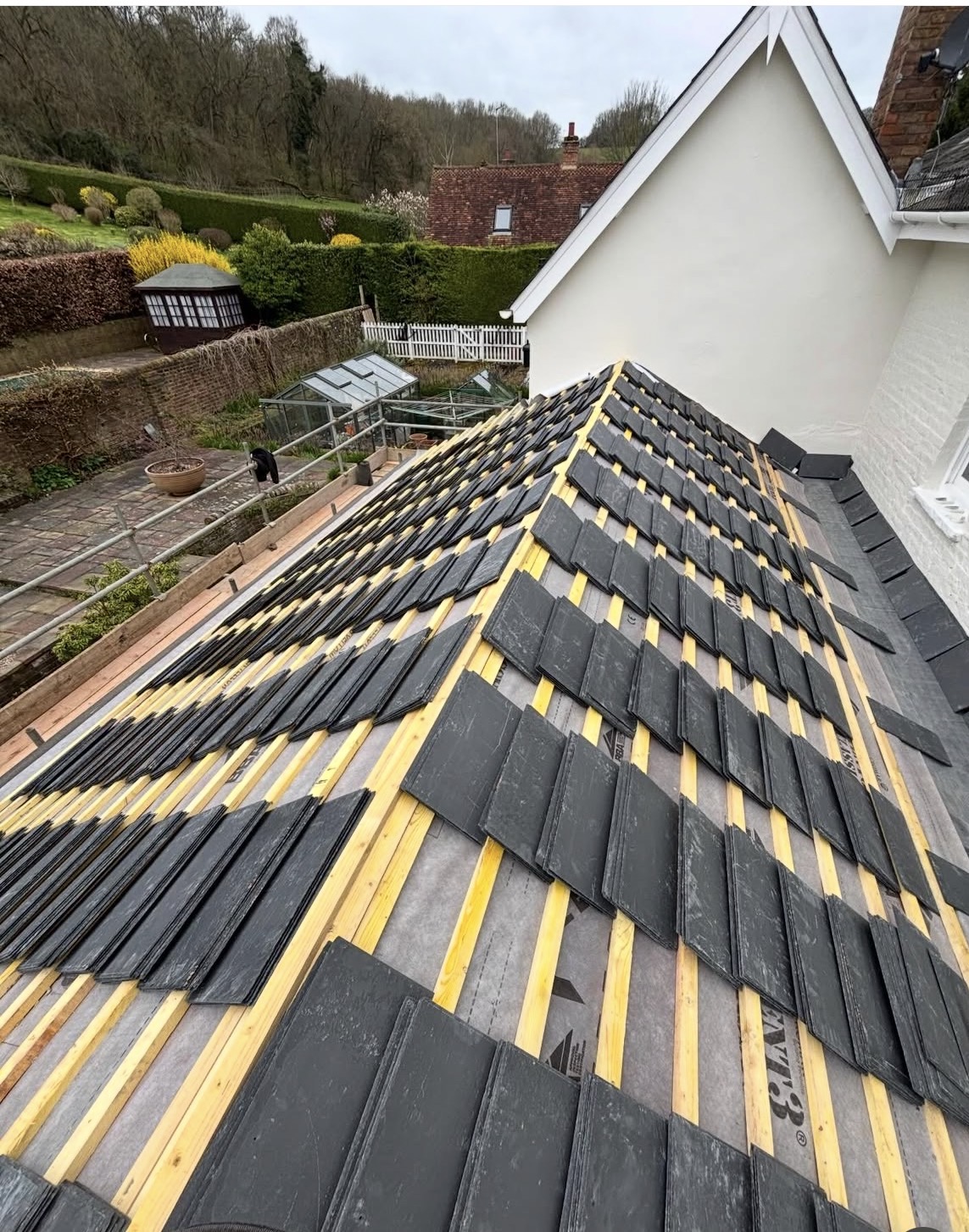 Slate roof batten and tile laying